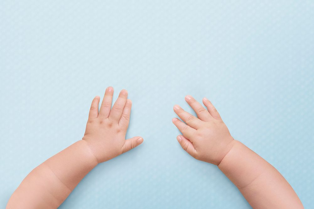 Baby hands blue background wallpaper 