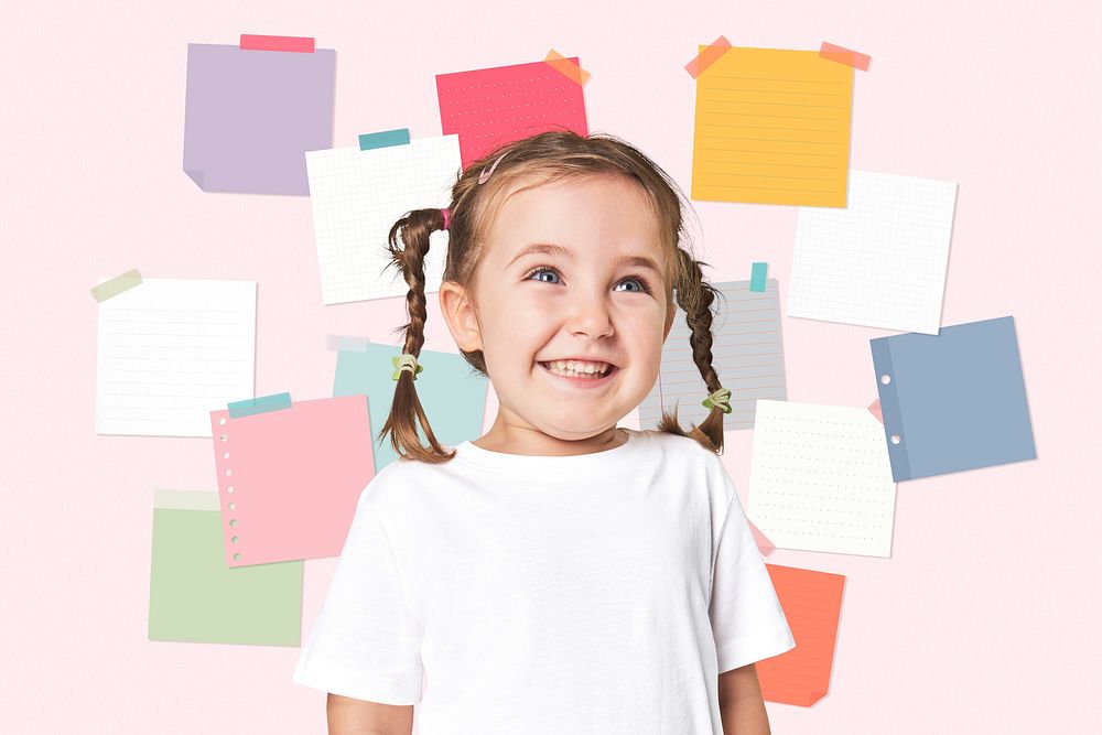 Happy girl student with blank colorful sticky notes