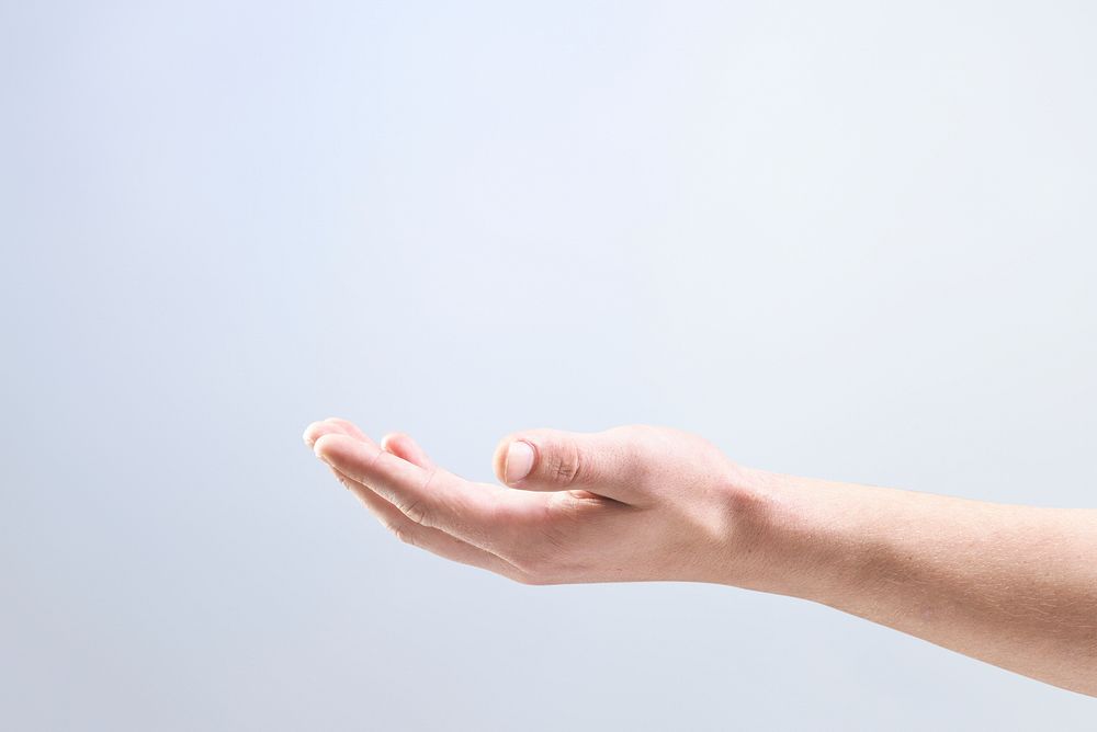 Woman’s hand background showing invisible object gesture