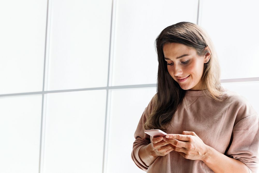 Woman holding smartphone background in the new normal remixed media