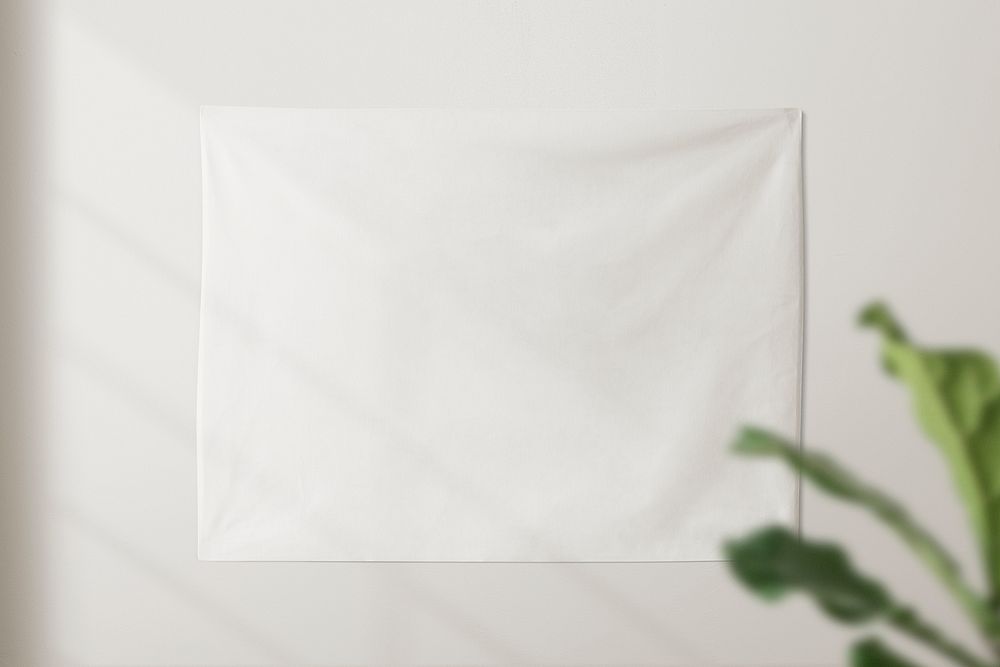 White blank wall tapestry with window shadow