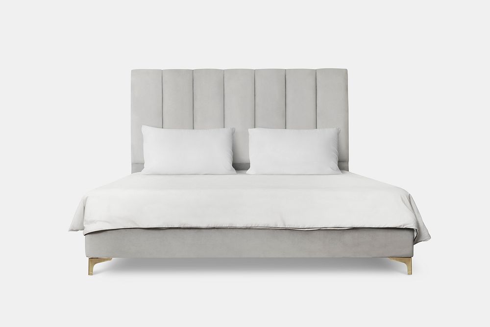 Upholstered bed with white bedding