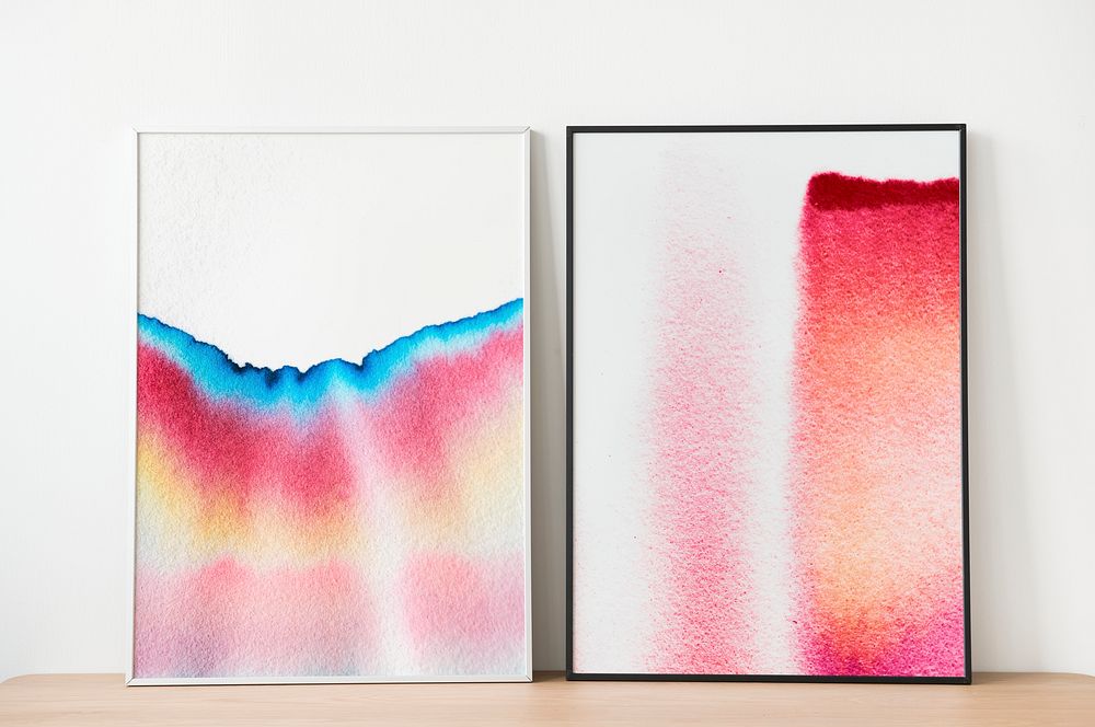 Picture frames with chromatography art leaning against the wall