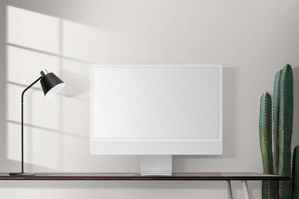 Blank computer screen on a desk in a retro home office