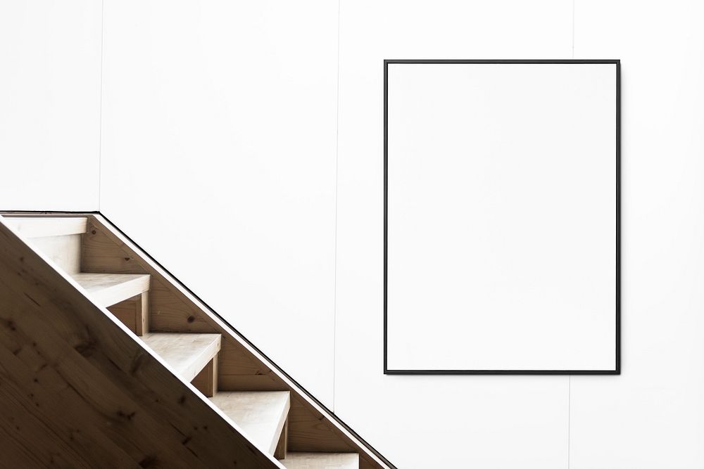 Frame by stairs on white wall