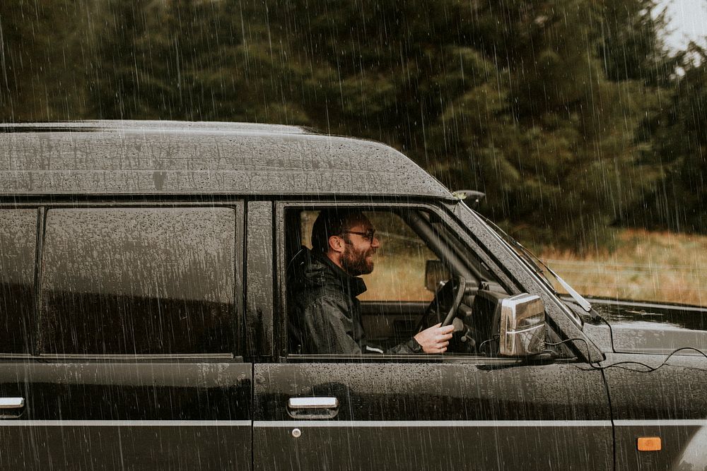 Man driving under the rain