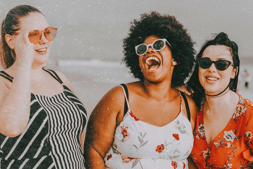 Plus sized women laughing, summer vacation at the beach