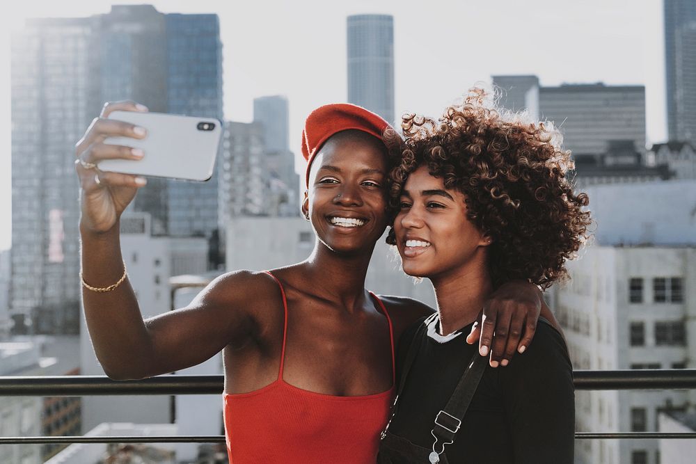 Smiling women taking selfies, friendship goals aesthetic