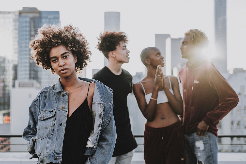 Friends hanging out on rooftop, urban photoshoot