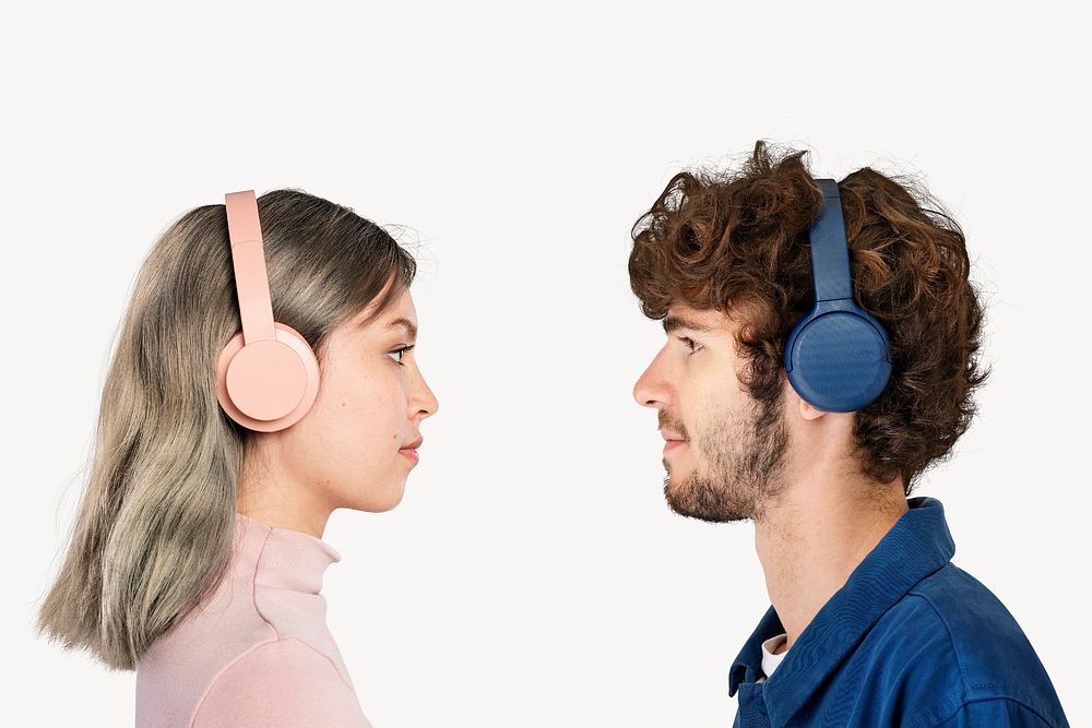 Couple with noise cancelling headphones, isolated on off white