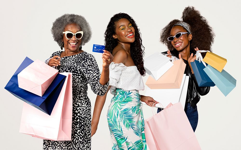 Women with shopping bags, isolated on off white