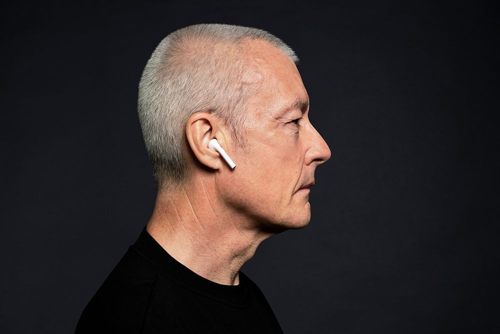 Man listening to music from earphones