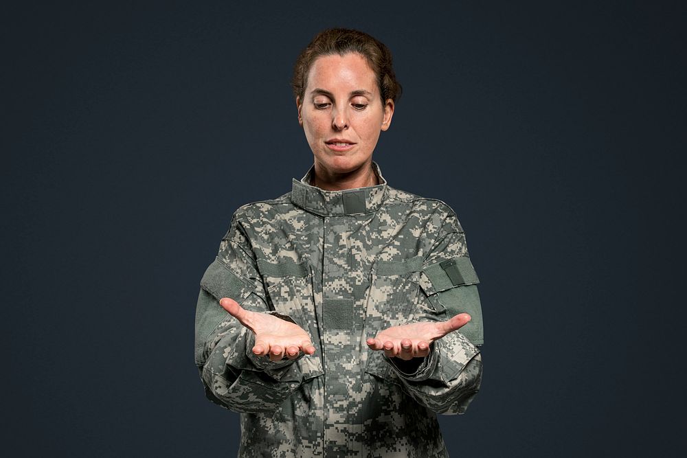 Female soldier presenting invisible object