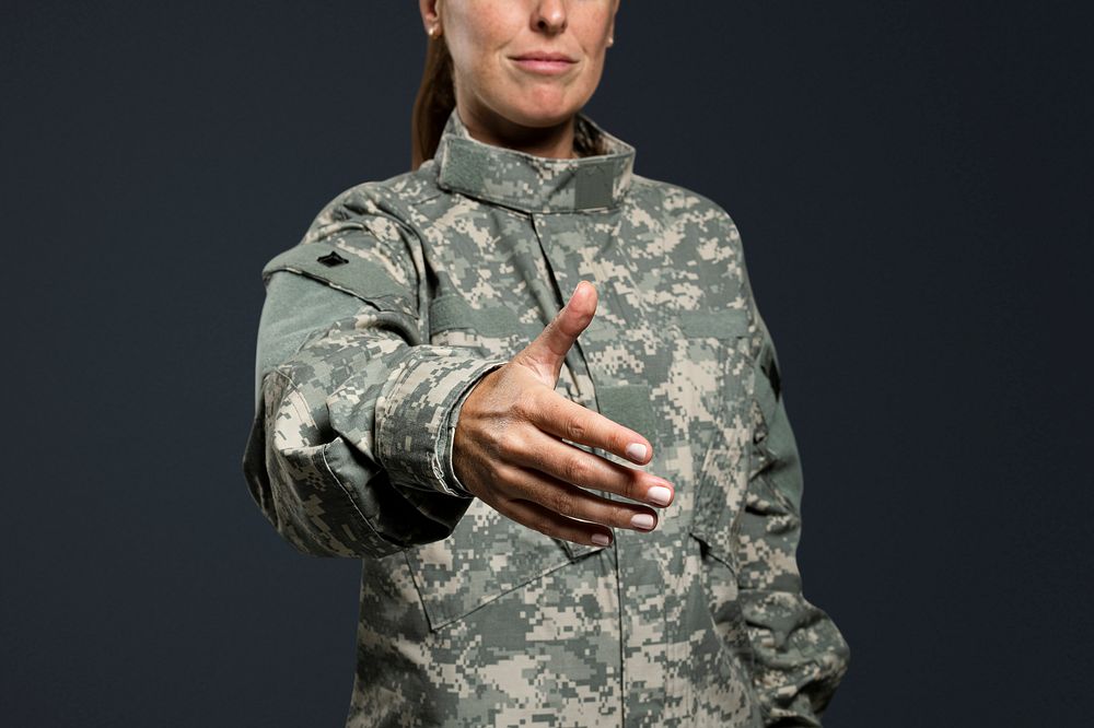 Female soldier extended out her hand