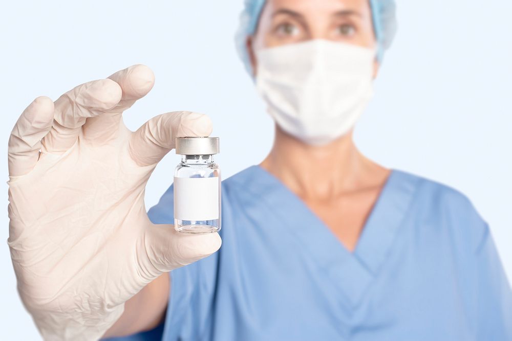 Female doctor holding a vaccine bottle