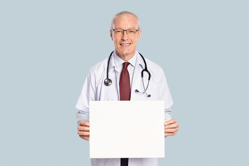 Male doctor showing a blank sign board