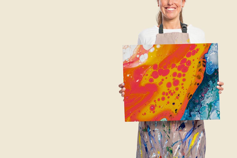 Female artist showing a canvas with fluid artwork