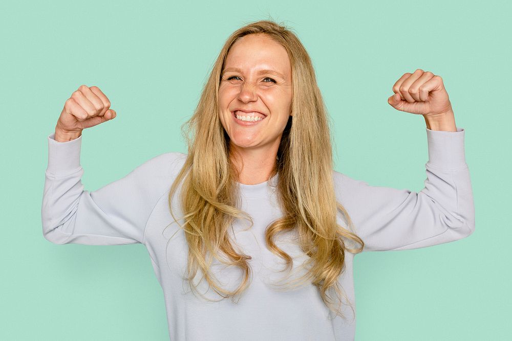 Woman flexing muscles for health and wellness campaign