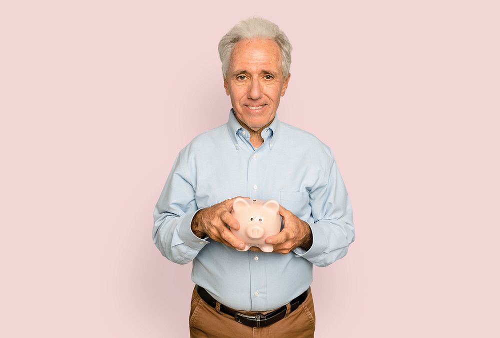 Senior man mockup psd holding piggy bank for financial savings campaign