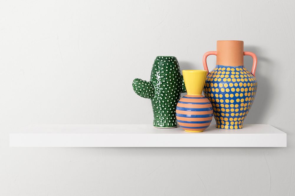 Colorful plant pots mockup psd on white shelf home decor