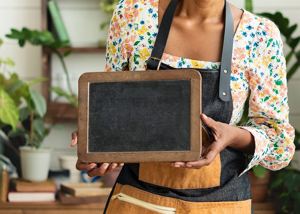 Small business owner holding a blank sign 