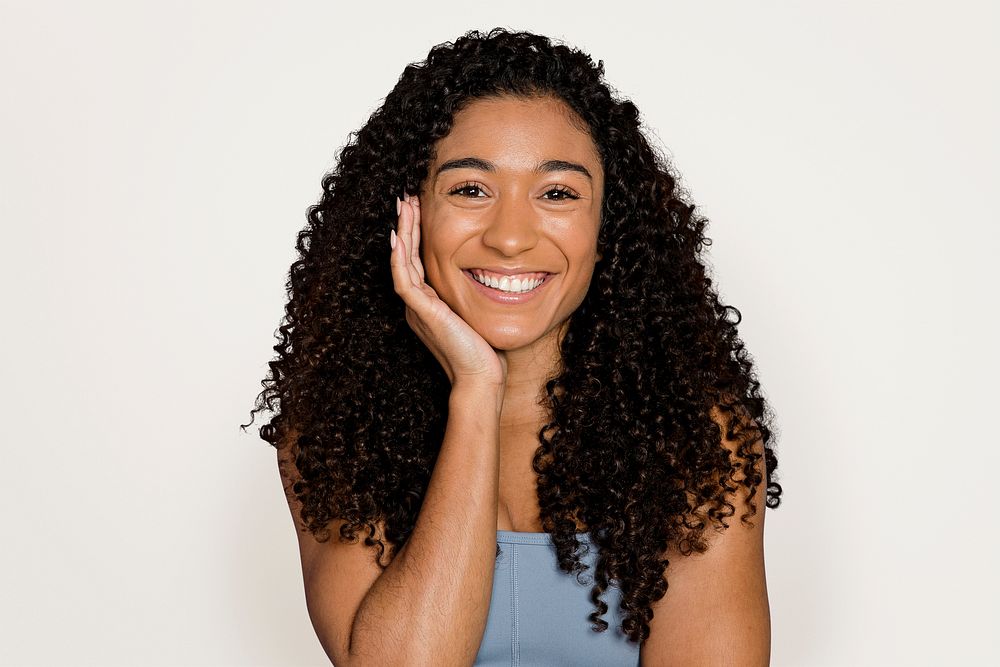 Beautiful African American woman, isolated on off white