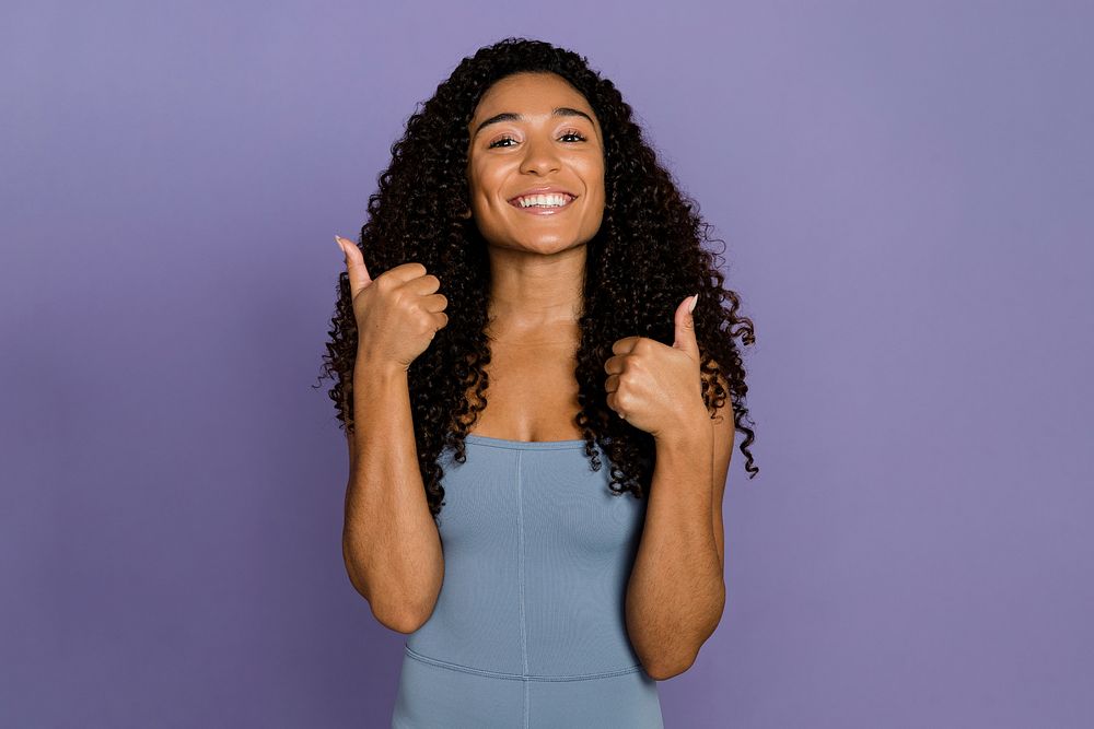 Positive woman giving thumbs up