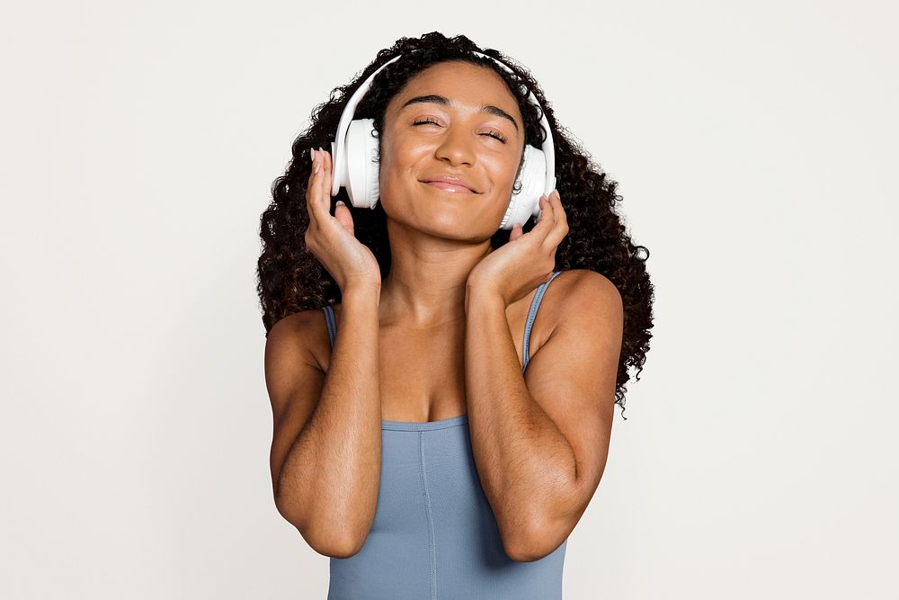 Woman wearing headphones and listening to music