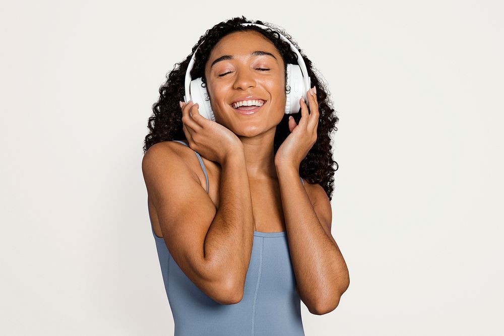 Woman wearing headphones and listening to music