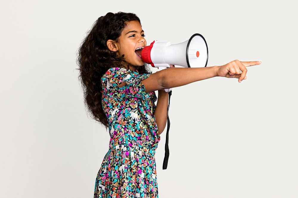 Little girl with megaphone, isolated on off white psd