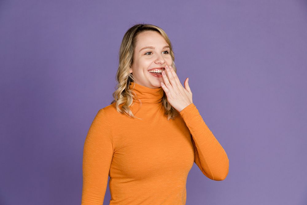 Surprised woman with hand over her mouth