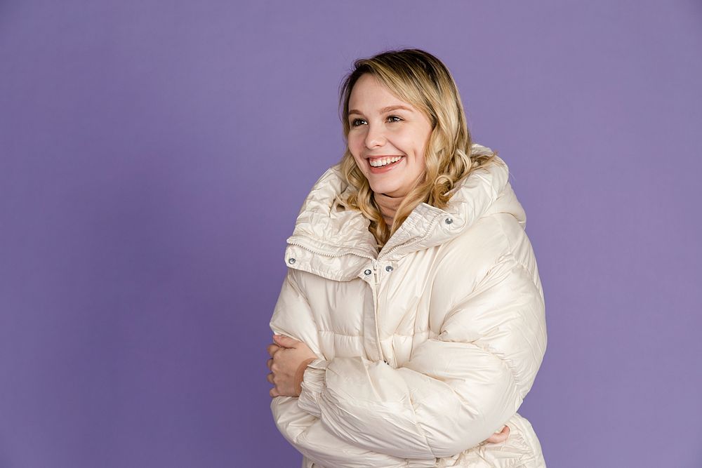 Blonde woman in white down jacket, winter outfit 