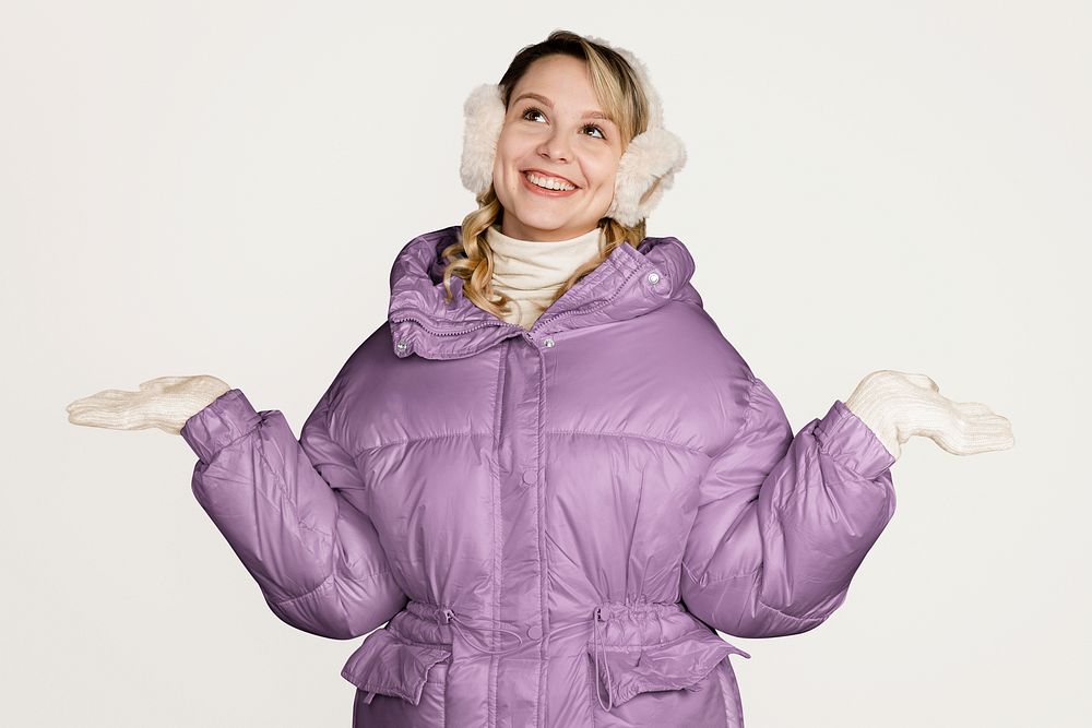 Surprised woman in winter outfit, isolated on off white