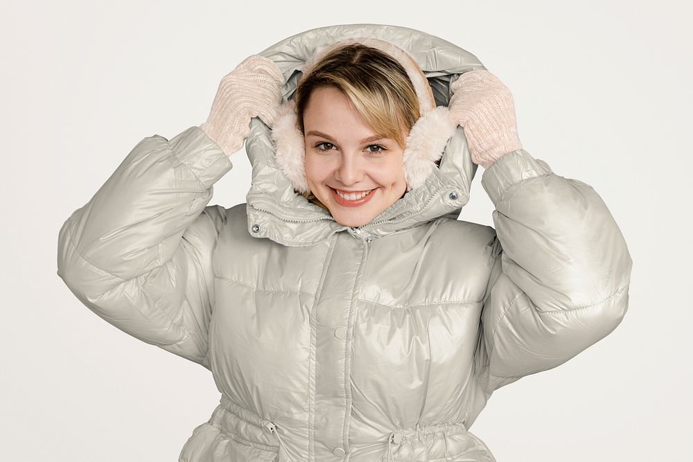Blonde woman in white down jacket, winter outfit 