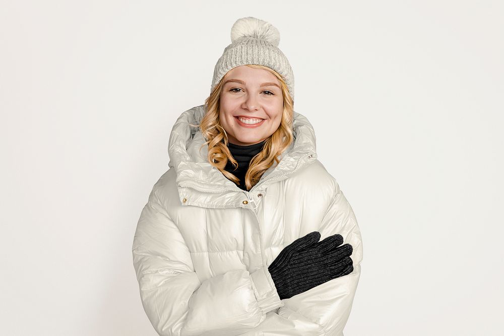 Blonde woman in white down jacket, winter outfit 