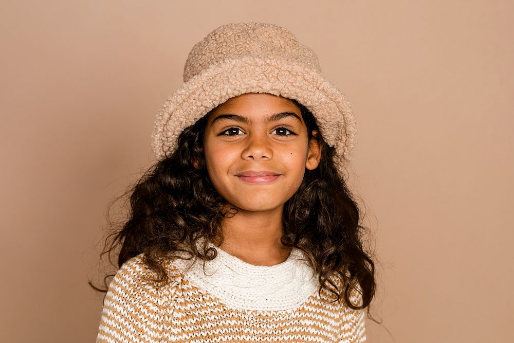 Cute girl in beige teddy hat