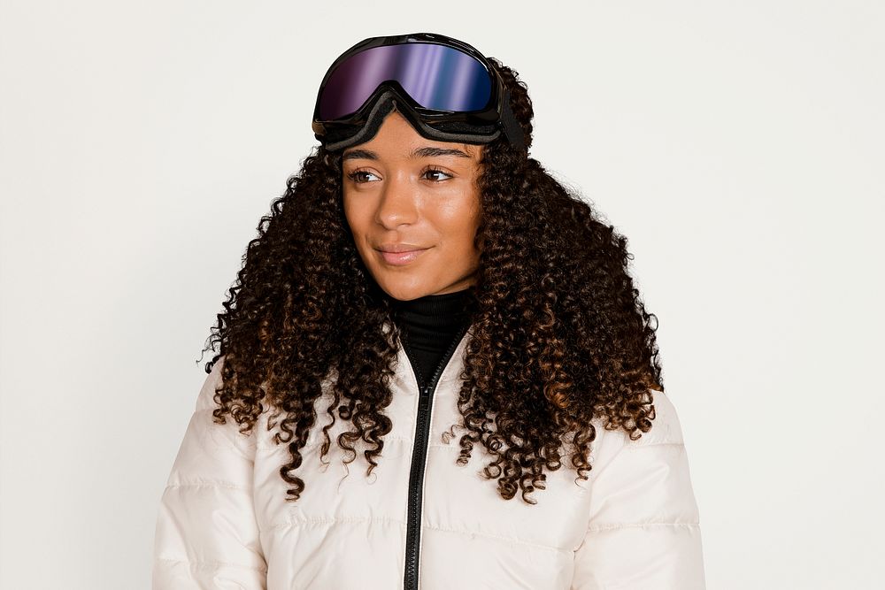 Woman in ski outfit, isolated on off white psd