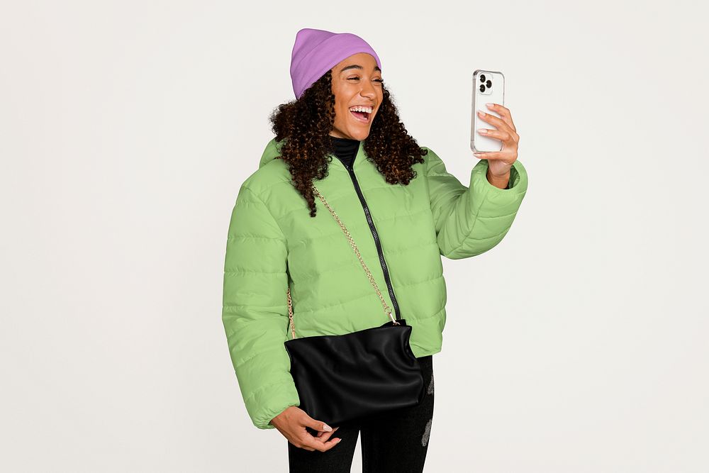 Happy woman in a video call, wearing winter clothes