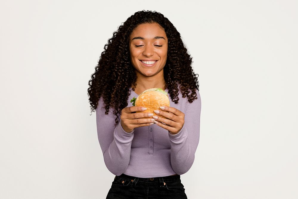 Hungry woman eating a hamburger