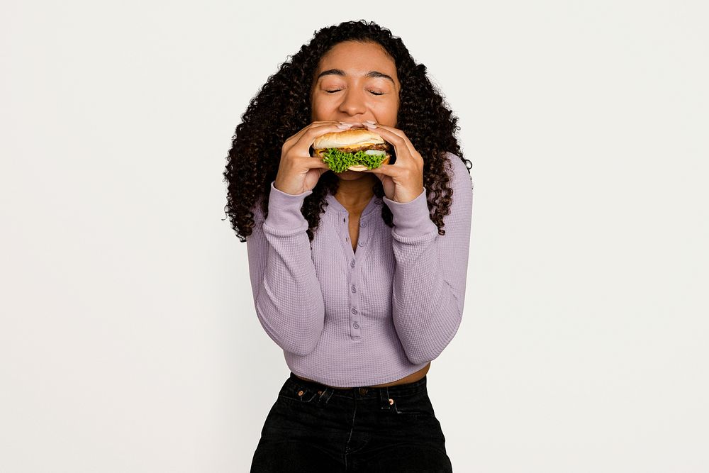 Woman enjoying a burger for lunch