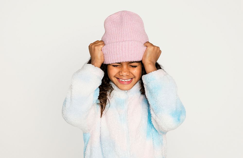 Happy kid in winter outfit, isolated on off white psd