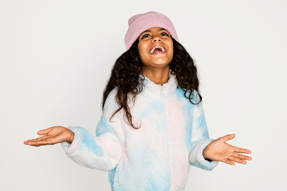 Little girl in winter outfit, isolated on off white psd