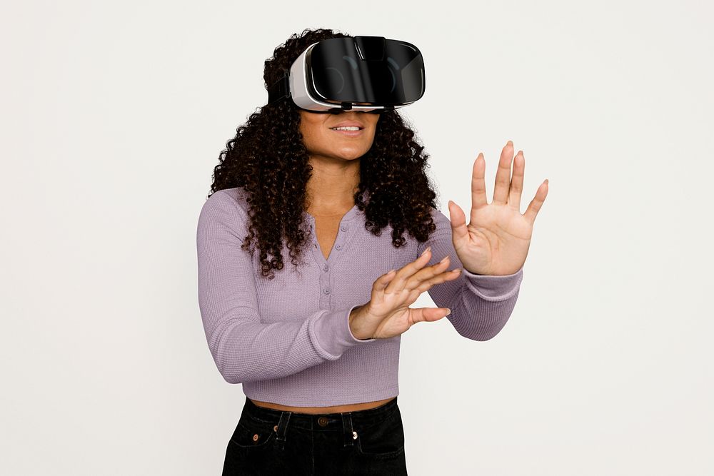 Woman experiencing in Metaverse through VR headset