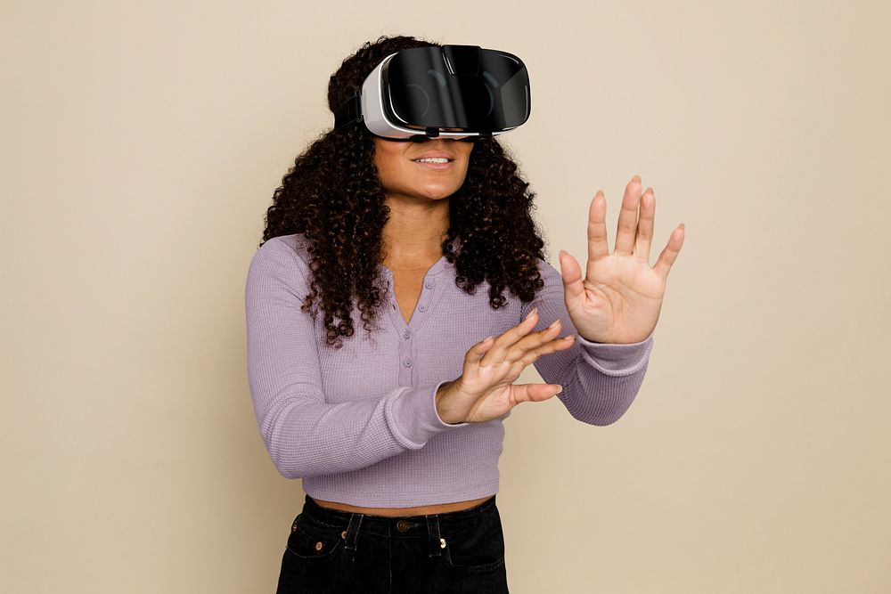 Woman experiencing virtual reality Metaverse through VR headset