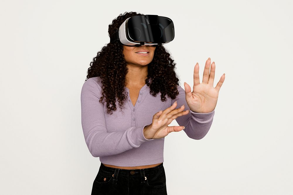 Woman experiencing virtual reality Metaverse through VR headset psd