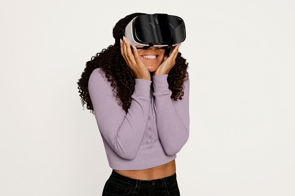 Woman experiencing virtual reality Metaverse through VR headset