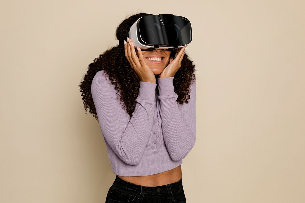 Woman experiencing in Metaverse through VR headset