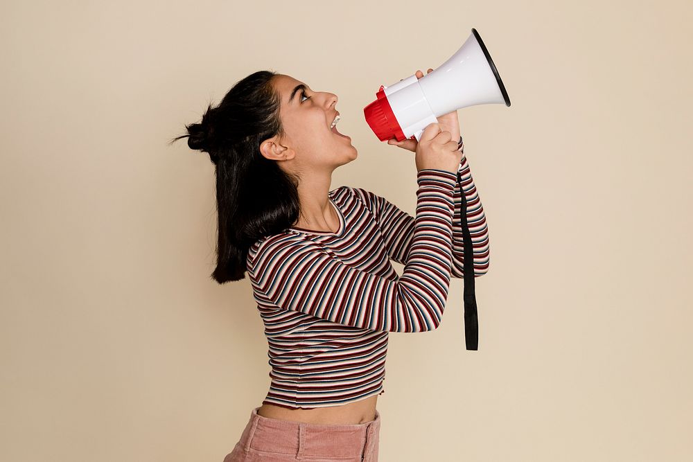 Feminist with megaphone shouting out message