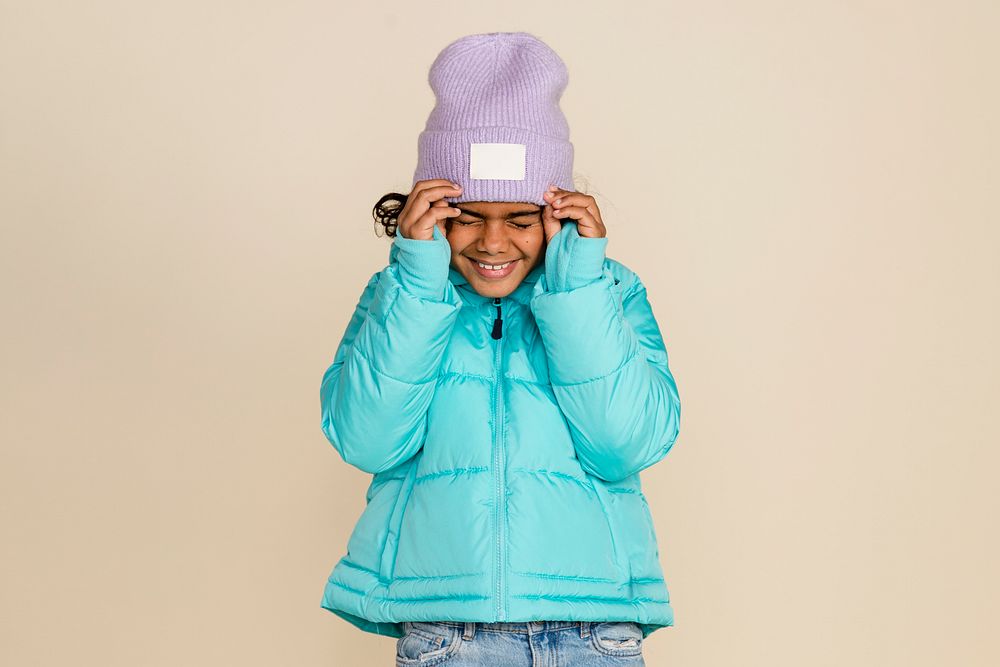 Kid wearing down jacket and beanie