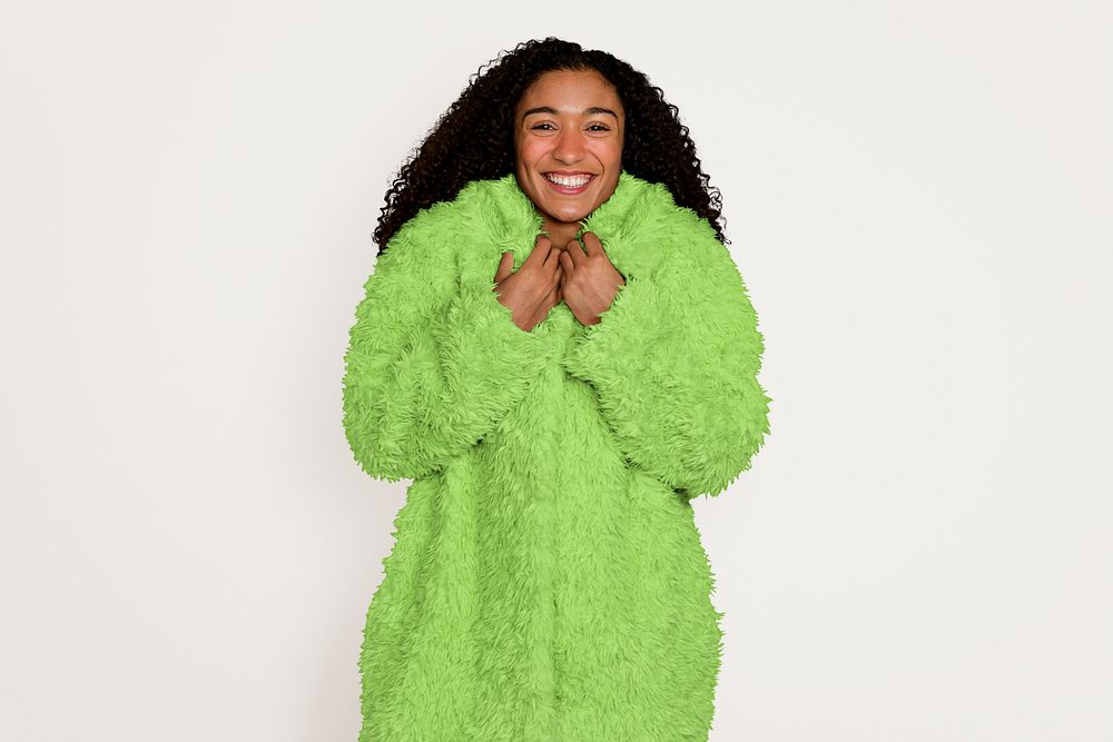 Woman wearing a warm teddy green coat